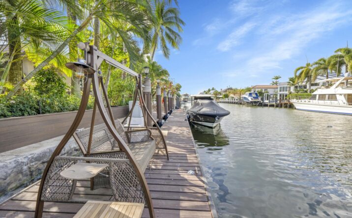 Waterfront residential dock and outdoor living area by CKA Construction