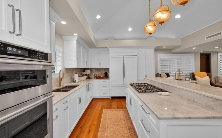 Bright white kitchen with custom cabinetry by CKA Construction